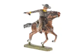 Lineol Cowboy zu Pferd reitend mit Pistole