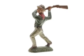 Lineol Cowboy mit Gewehr schlagend