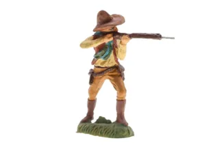 Massefigur Cowboy mit Gewehr stehend schiessend